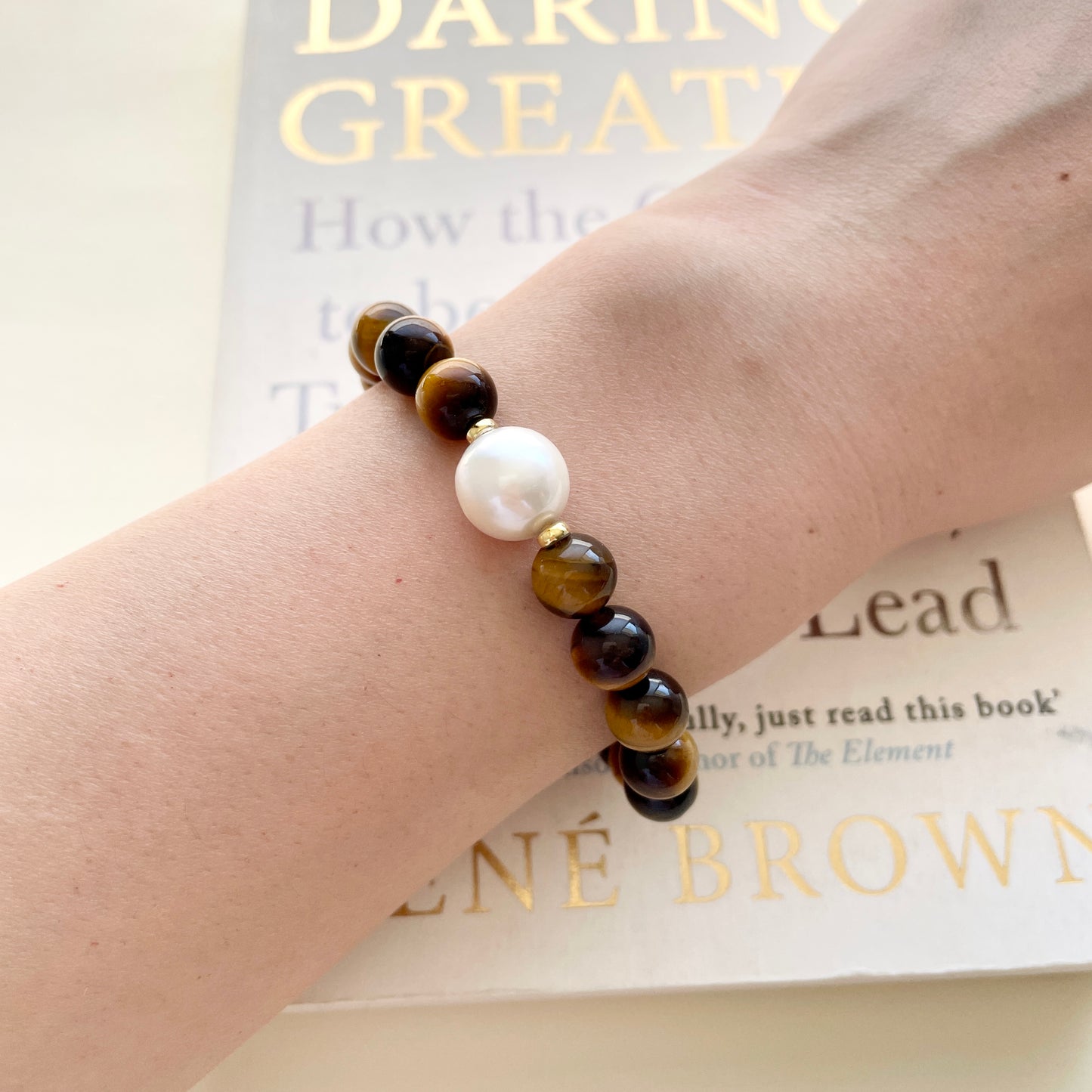 Large pearl bracelet courage on wrist