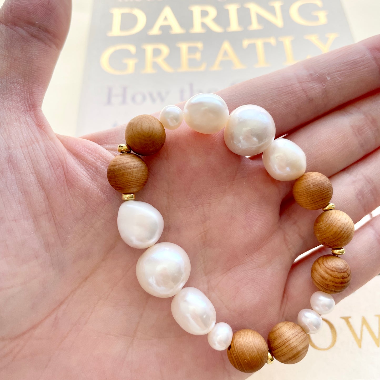 Large pearl bracelet growth on hand