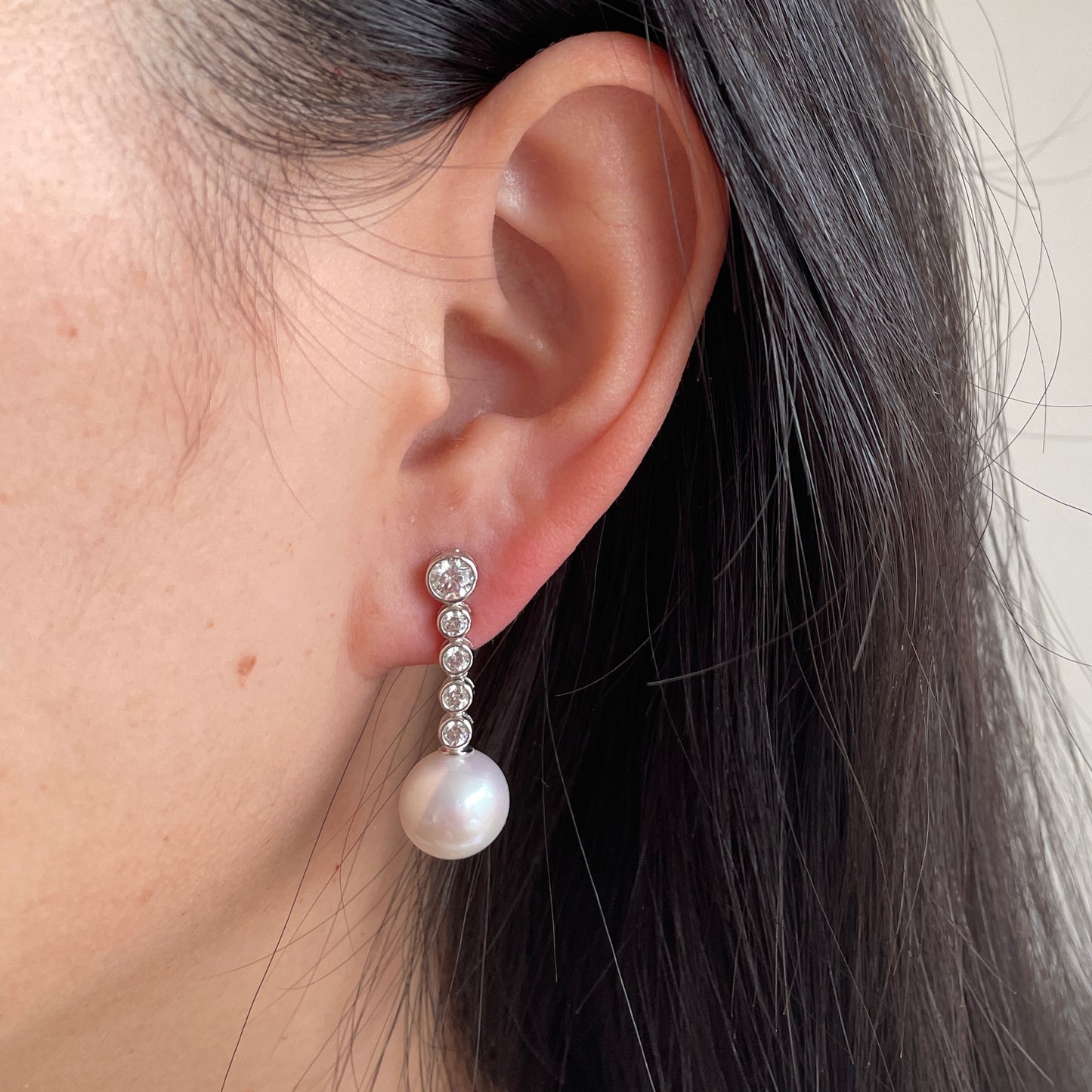 bridal pearl earrings on ear