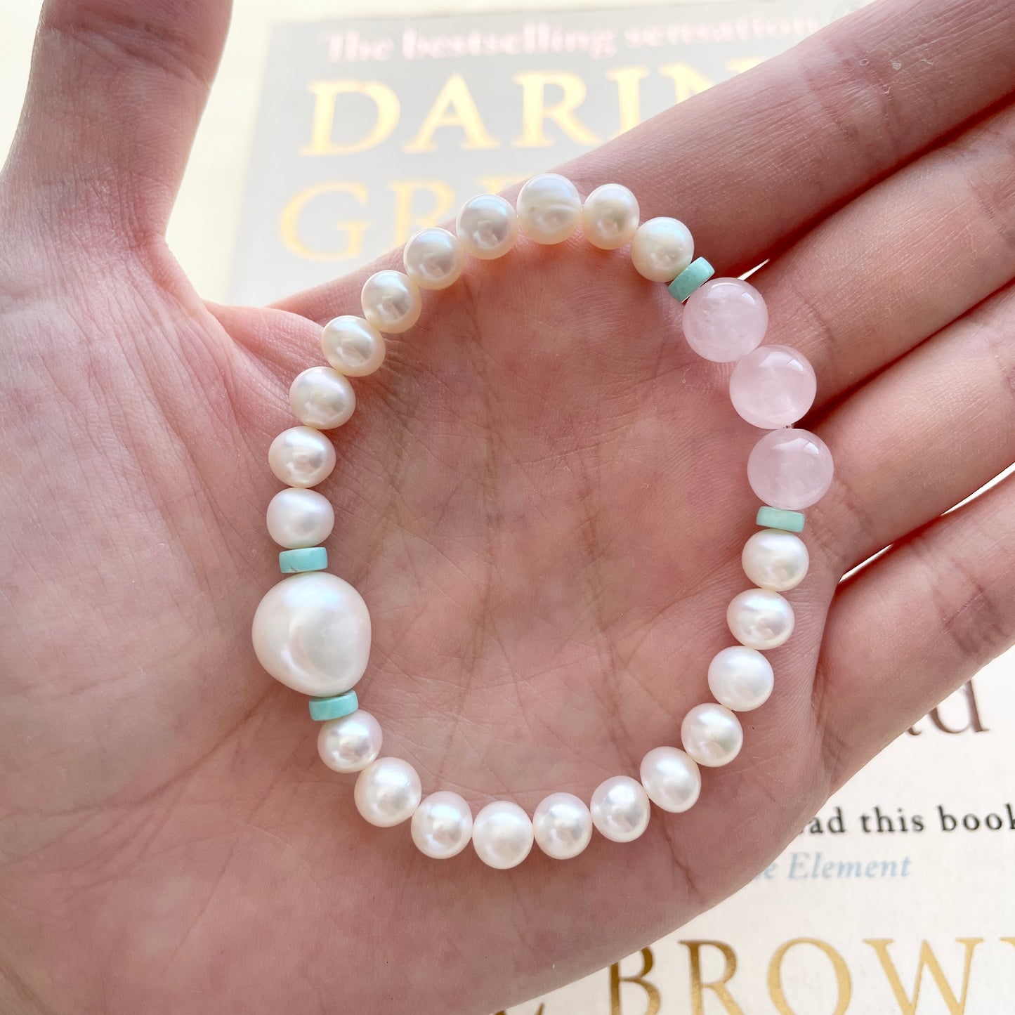 pearl bracelet self acceptance on hand