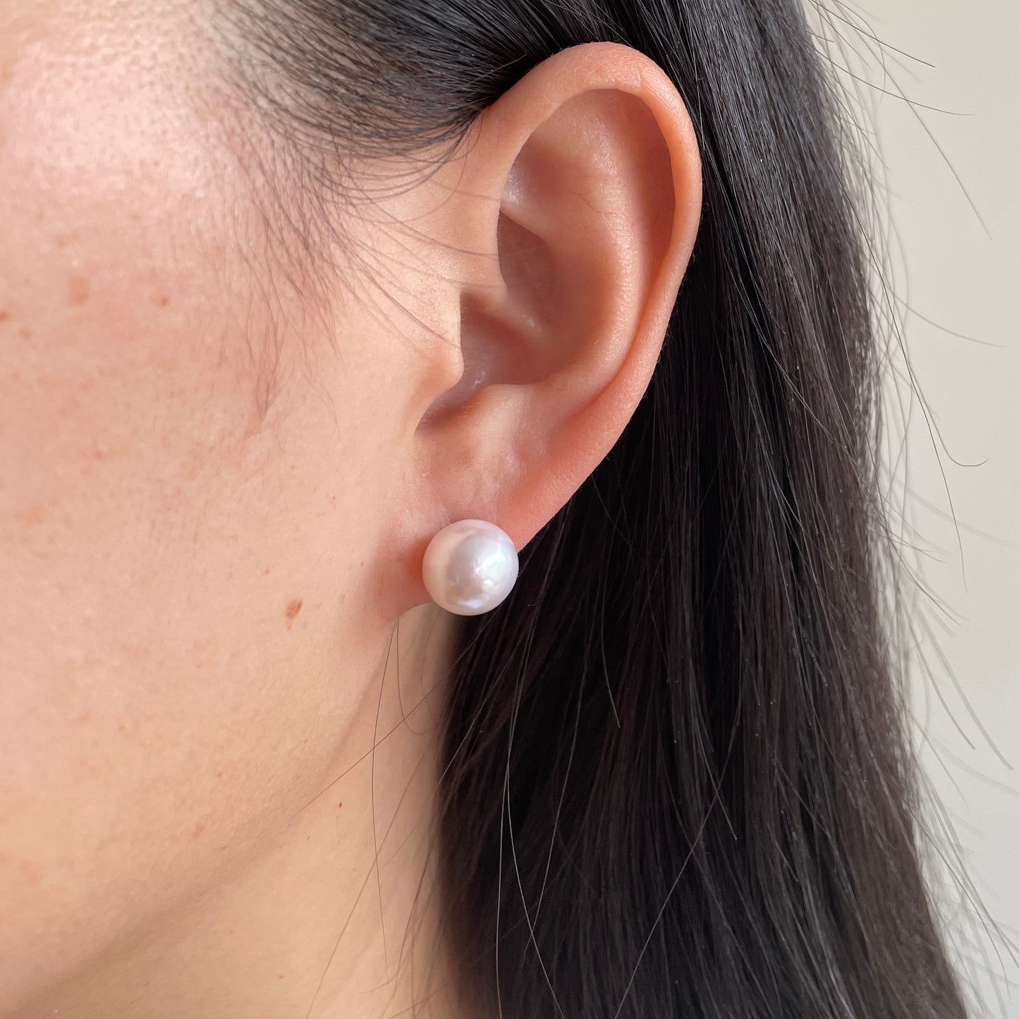 pearl earrings on ear