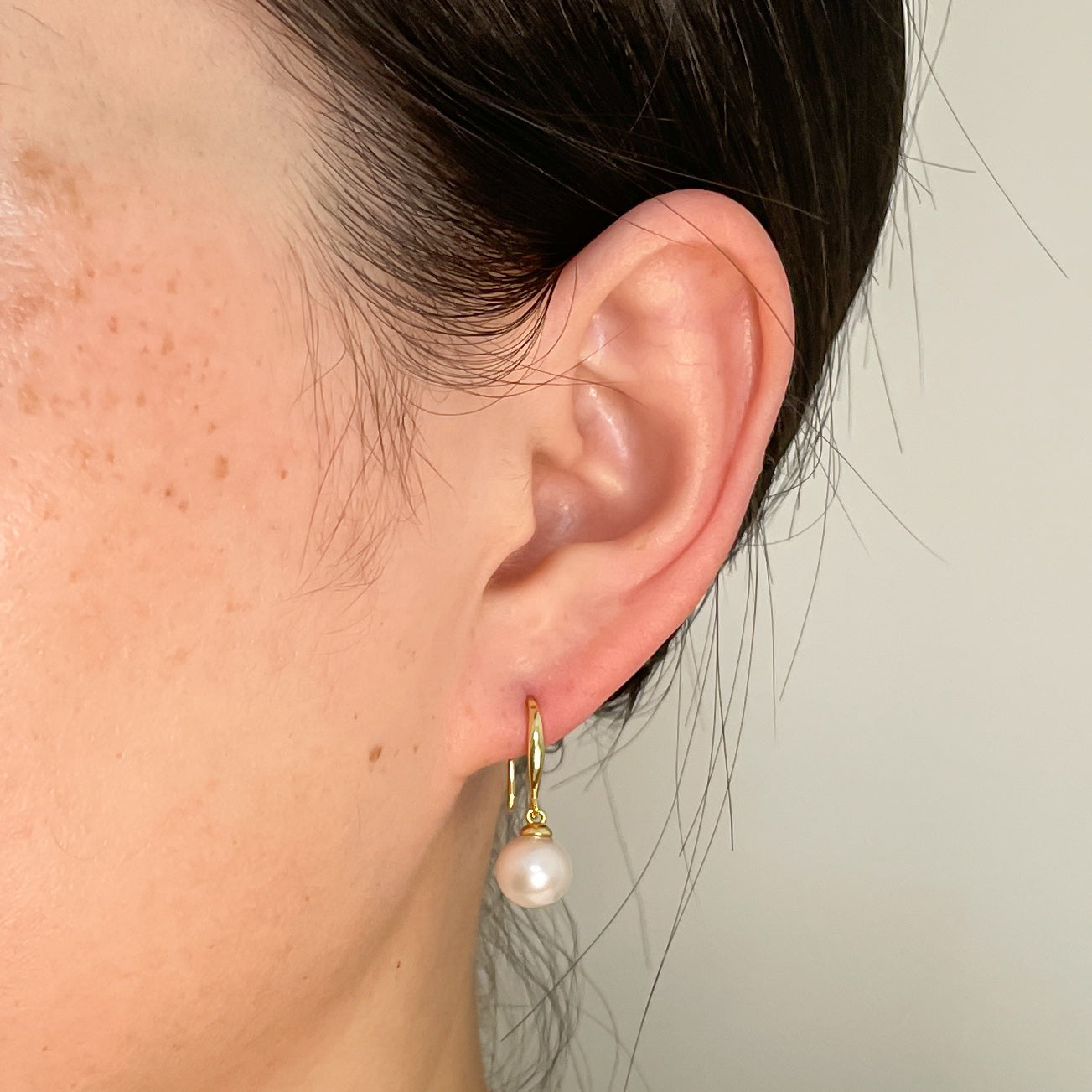 simple hook earrings on ear