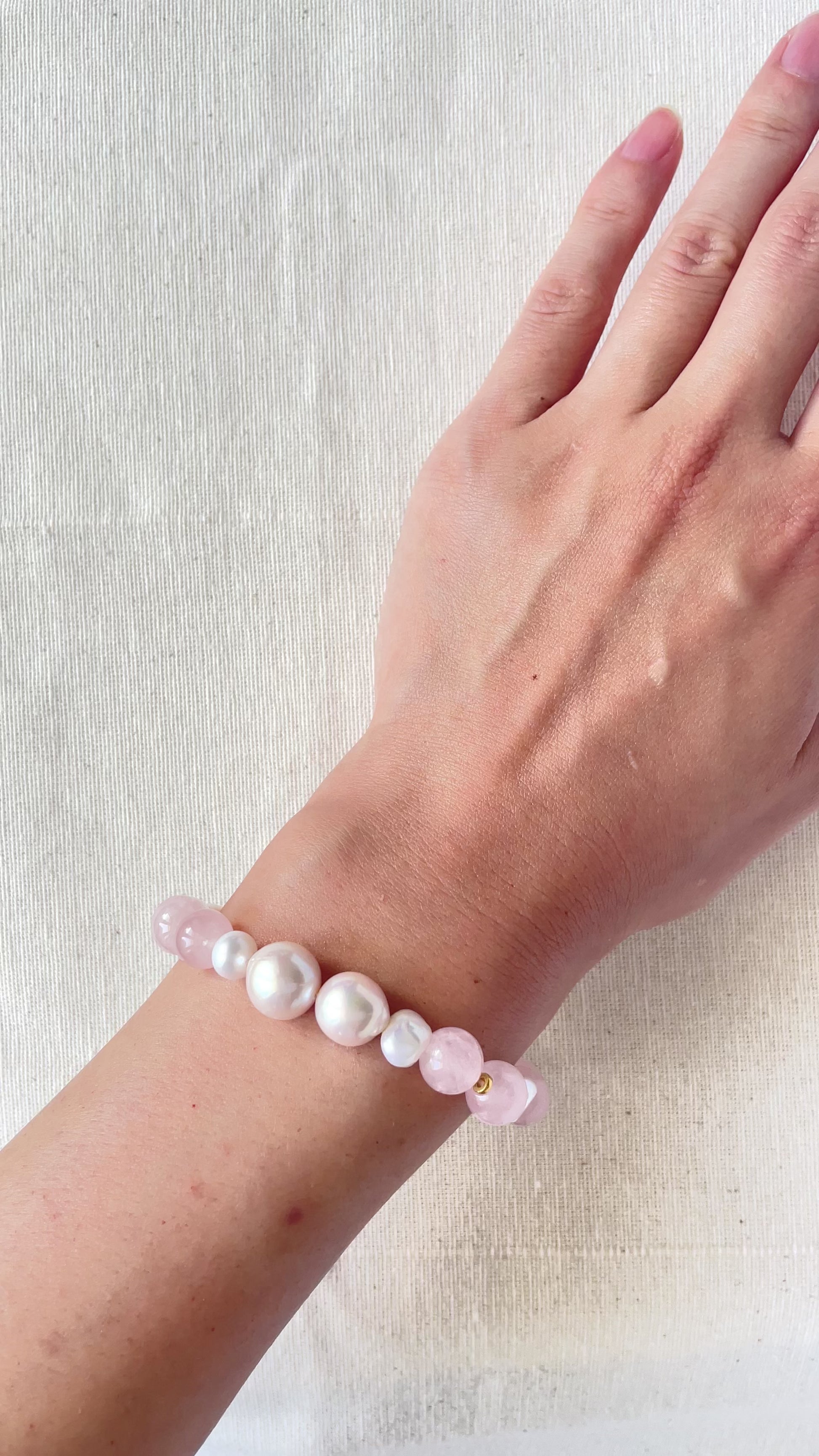 pearl bracelet love on wrist